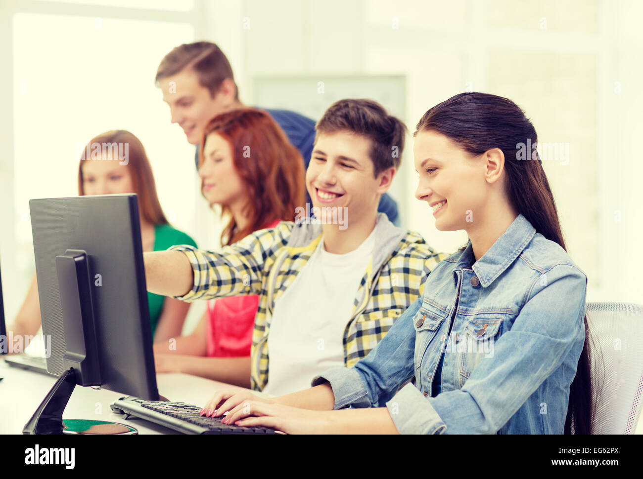 female student with classmates in computer class Stock Photo - Alamy