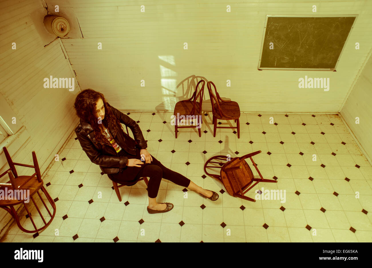 a-17-year-old-girl-wearing-different-vintage-dresses-sits-in-a-antique