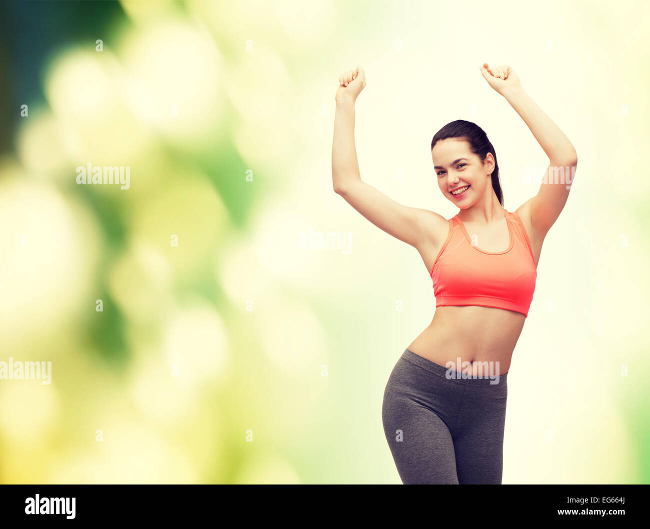 smiling teenage girl in sportswear dancing Stock Photo