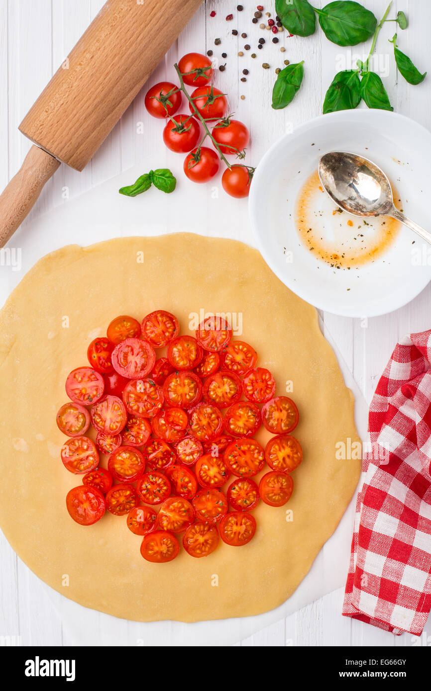 Cherry tomato tart. Cooking process Stock Photo Alamy