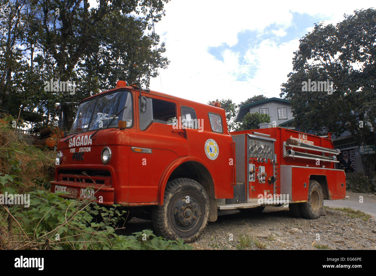 Old fire truck in Sagada. Philippines Luzon Island The Cordillera Mountains Mountain Province Banga an Village Houses Stock Photo