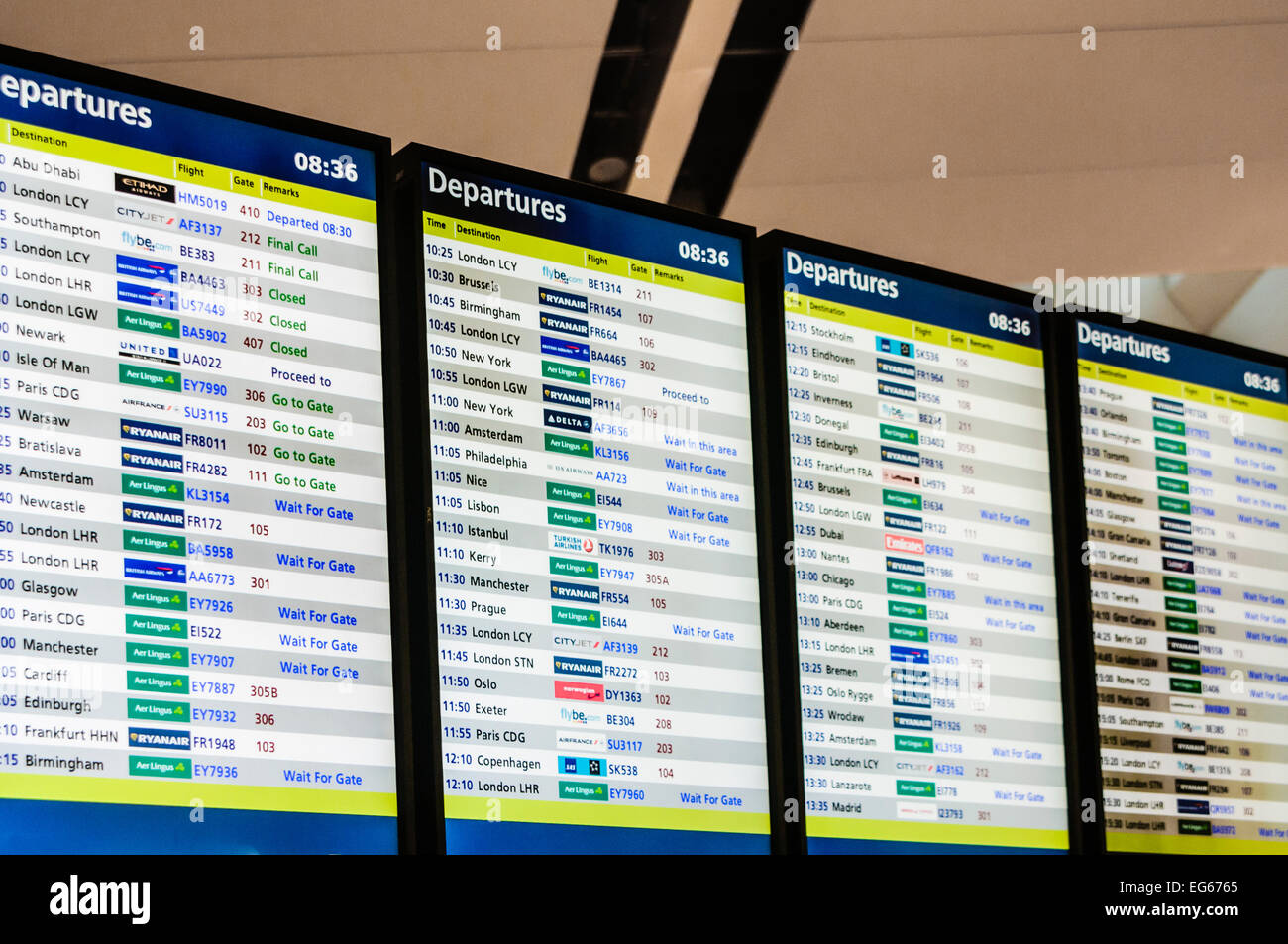 Departures board at an airport Stock Photo