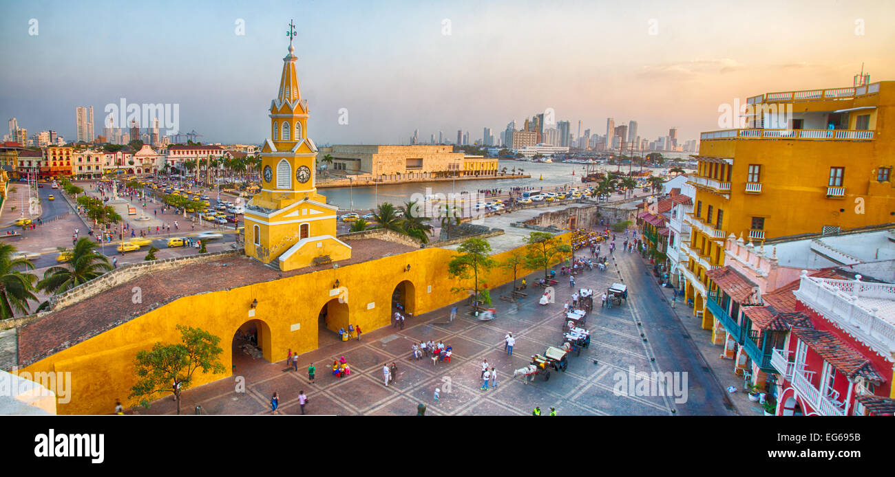 Cartagena, Colombia - February 21st, 2014 - Horsedrawn carriages and haukers wait for tourists and restaurant goers in the Plaza Stock Photo