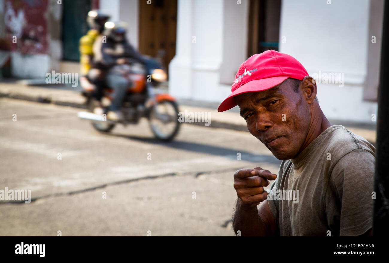 Cartagena, Colombia February 23, 2014 a man gestures to the camera in the colorful streets