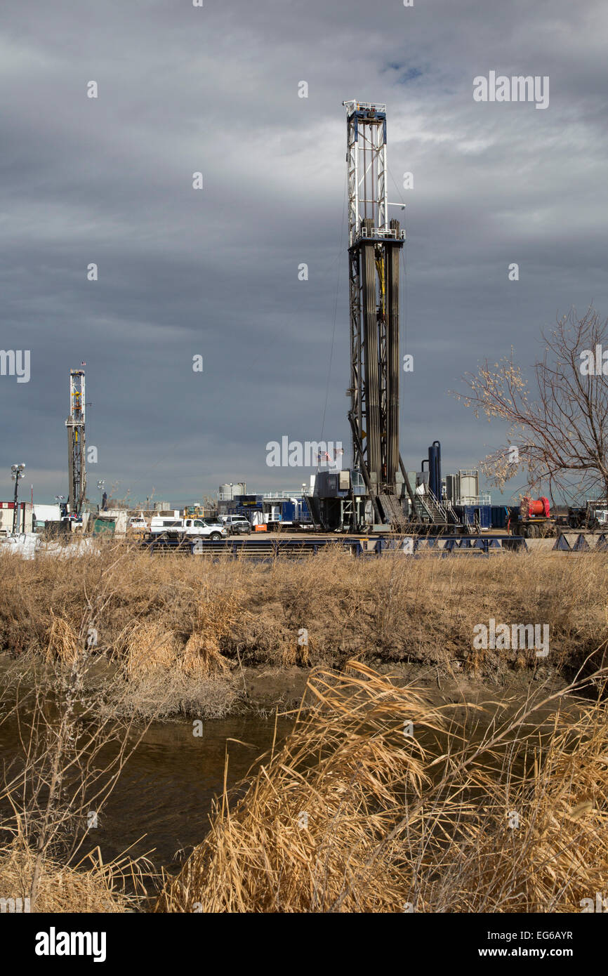 Kersey, Colorado - Oil drilling rigs on farmland. Stock Photo