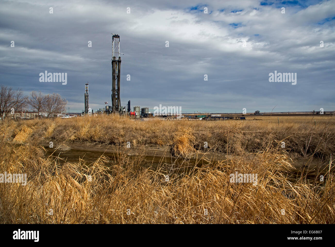 Kersey, Colorado - Oil drilling rigs on farmland. Stock Photo