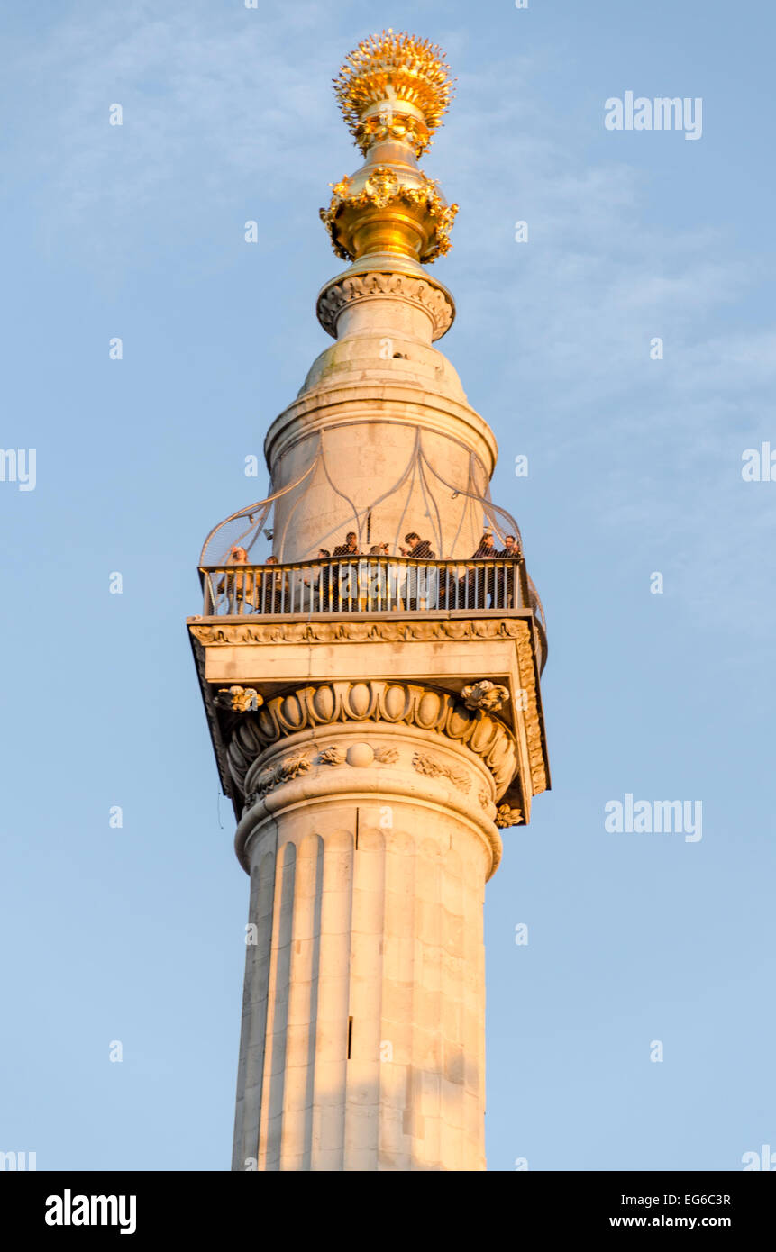 London, UK 17th February 2015: People enjoying the evening sun from the top of the Monument to the Great Fire of London (Sir Christopher Wren and Robert Hooke) Credit:  David Jackson/Alamy Live News Stock Photo