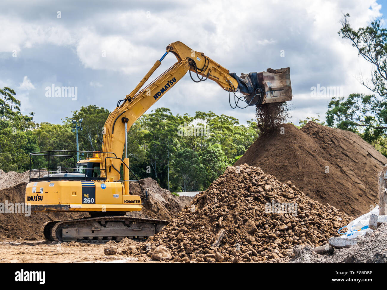 Komatsu earth moving machine sorting and sifting soil. Stock Photo