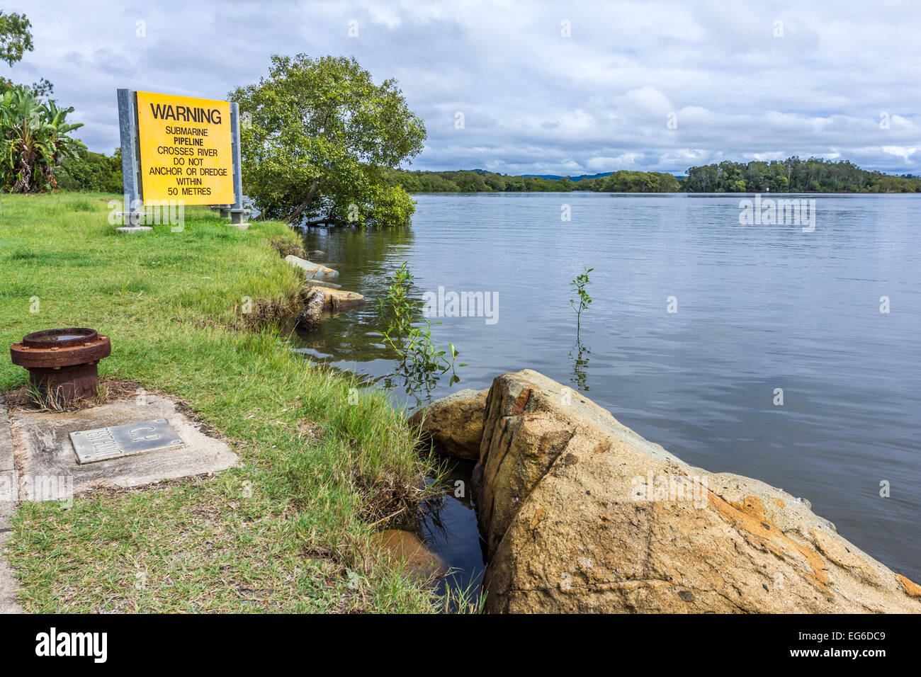 Pipeline crossing point on Maroochy River Sunshine Coast Queensland. Stock Photo