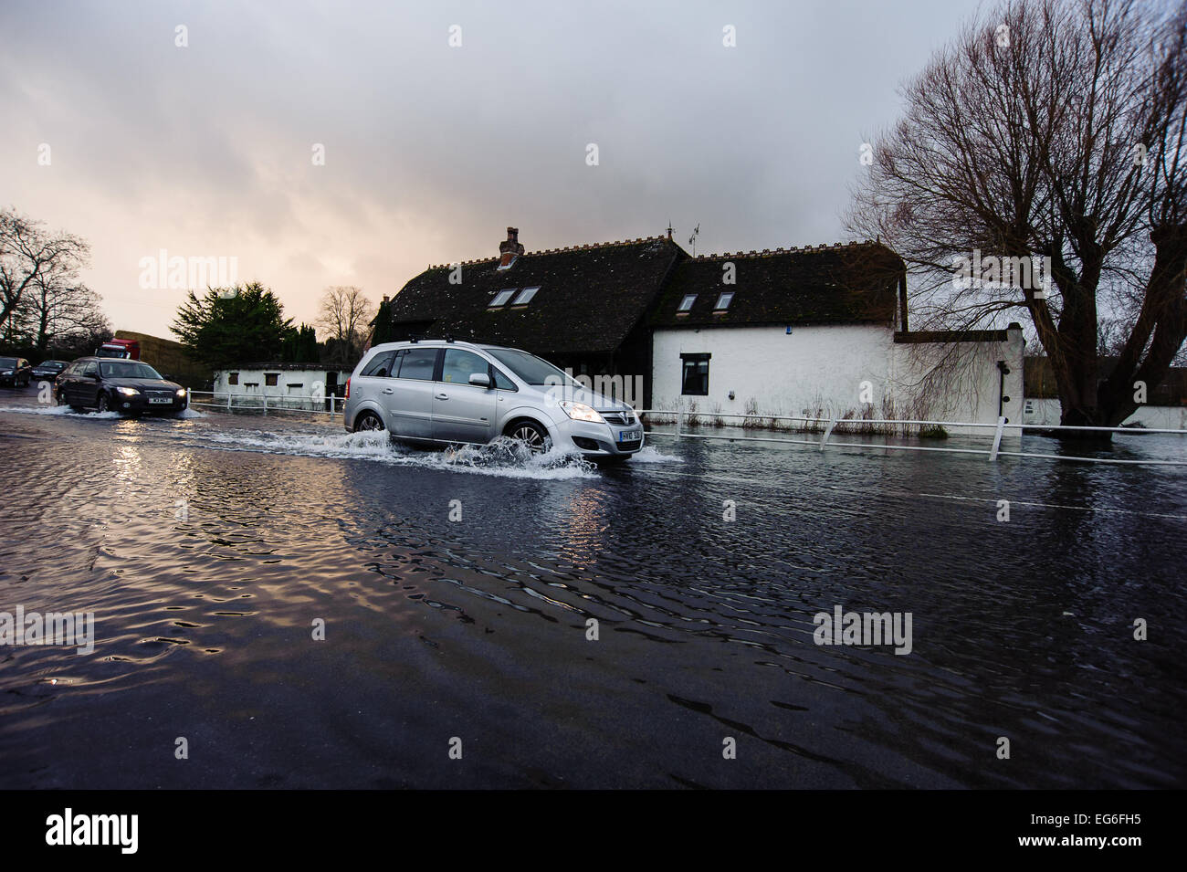 car driving through flood water at Coombe Bisset near Salisbury Stock
