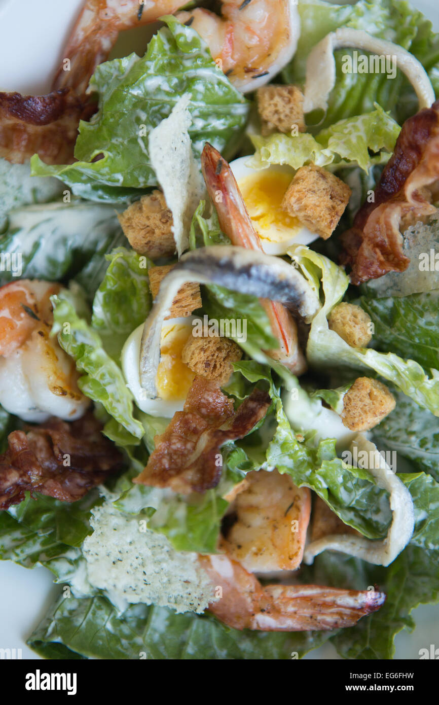 Prawn caesar salad with quails egg, pancetta and parmesan crisps Stock