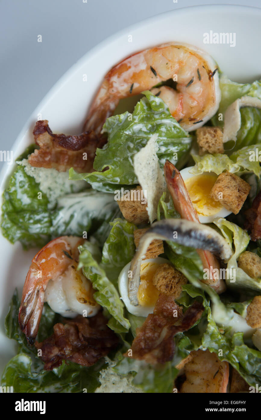 Prawn caesar salad with quails egg, pancetta and parmesan crisps Stock