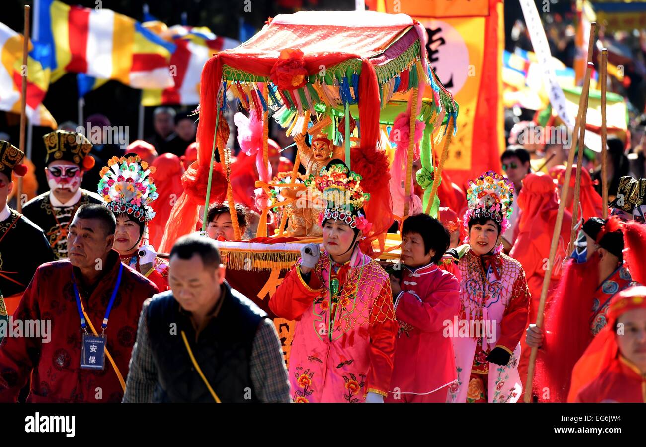 Beijing, China. 18th Feb, 2015. People take part in a traditional ...