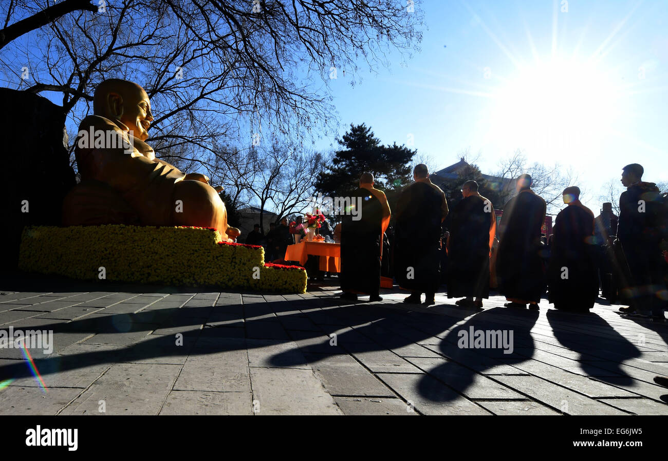 Beijing, China. 18th Feb, 2015. Monks of Lingguang Temple hold a ...