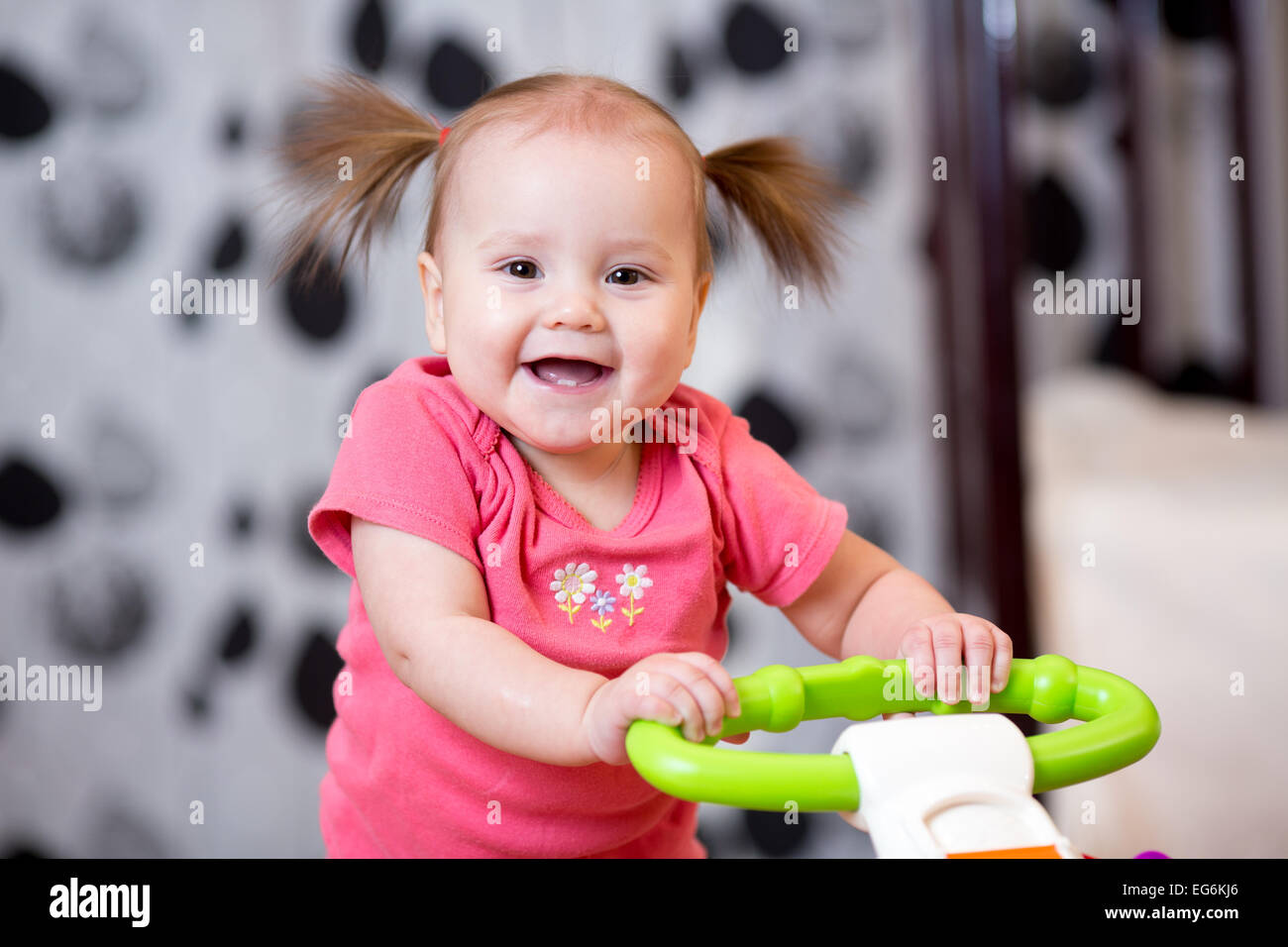 Cute baby learning to walk Stock Photo