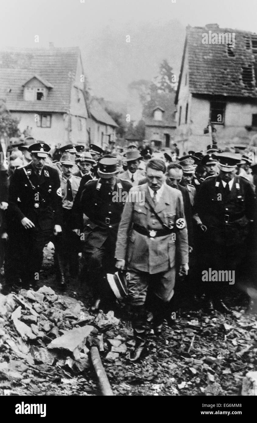Adolf Hitler, with German military and officials, inspects bomb damage in a German city in 1944. World War 2. (BSLOC 2014 8 167) Stock Photo