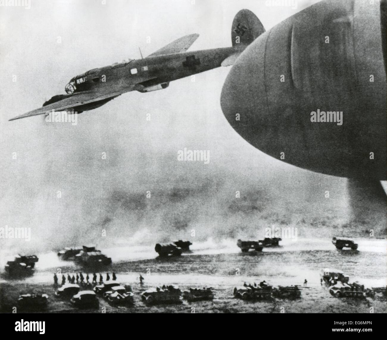 First days of the German Invasion of the Soviet Union in June 1941. German bombers fly over Nazi invasion vehicles. Ca. June Stock Photo