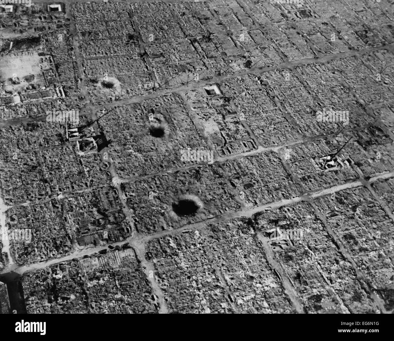 Aerial view of Osaka, Japan, after firebombing by U.S. incendiary bombs. The city suffered three bombing campaigns by B-29 Stock Photo