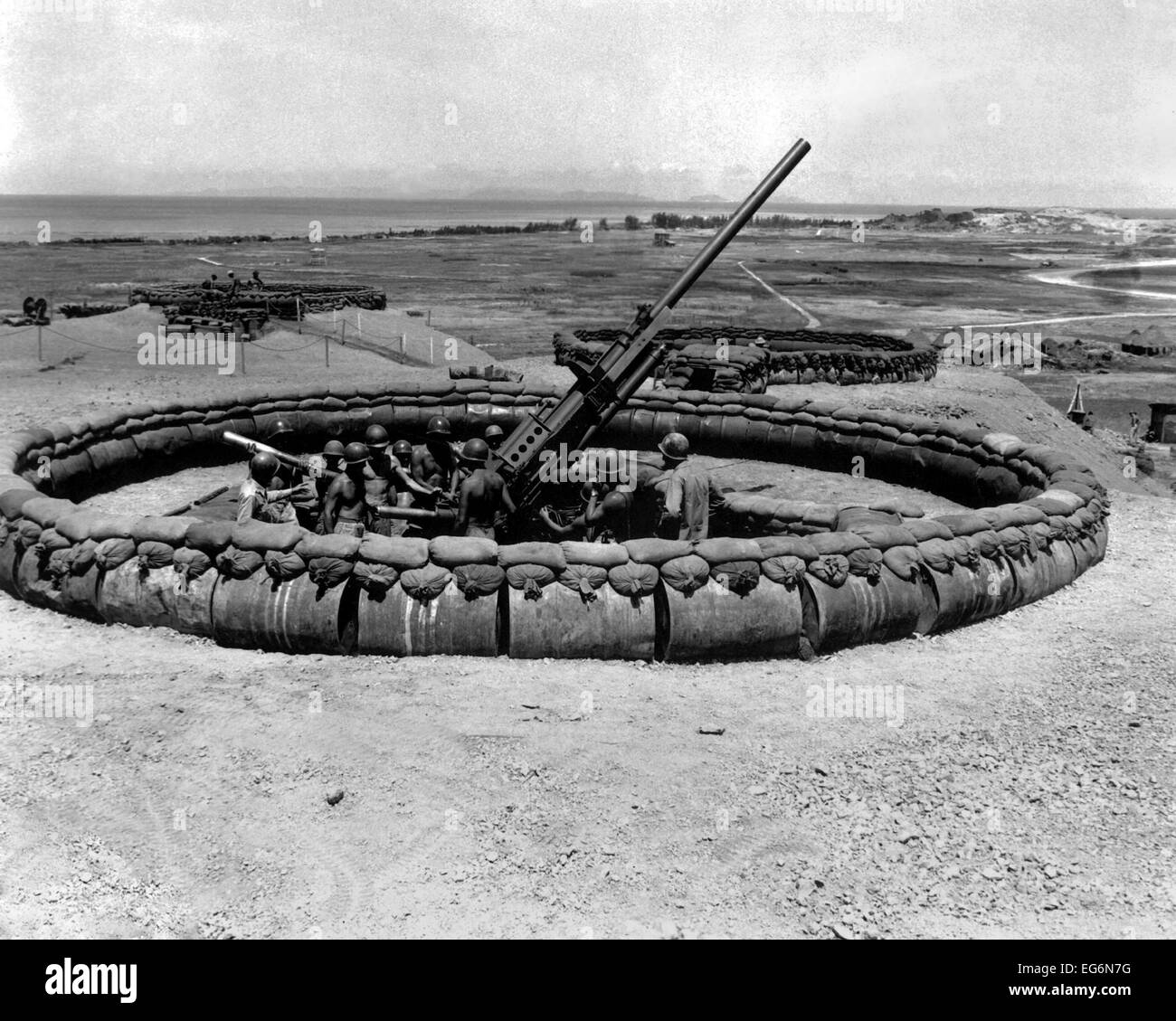 90mm anti-aircraft gun emplacement with crew in pit on Okinawa, July 18, 1945. World War 2. (BSLOC 2014 10 155) Stock Photo