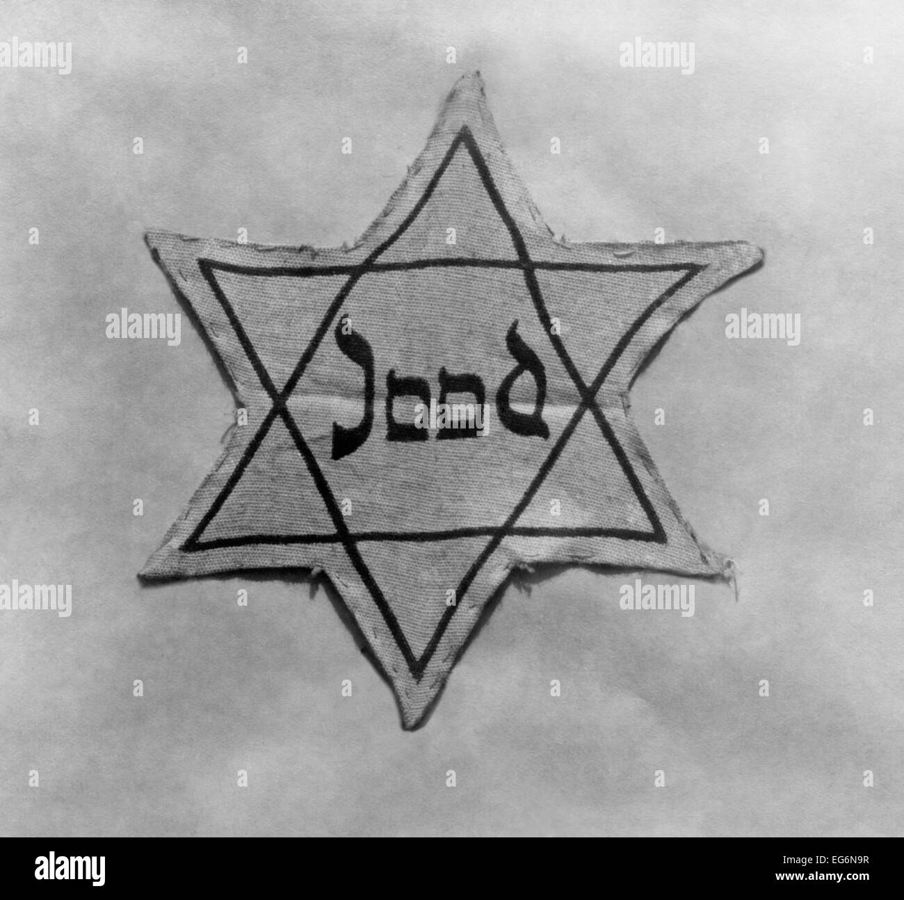 Yellow and black star which the Jews were required to wear in occupied Holland during World War 2. (BSLOC 2014 10 183) Stock Photo