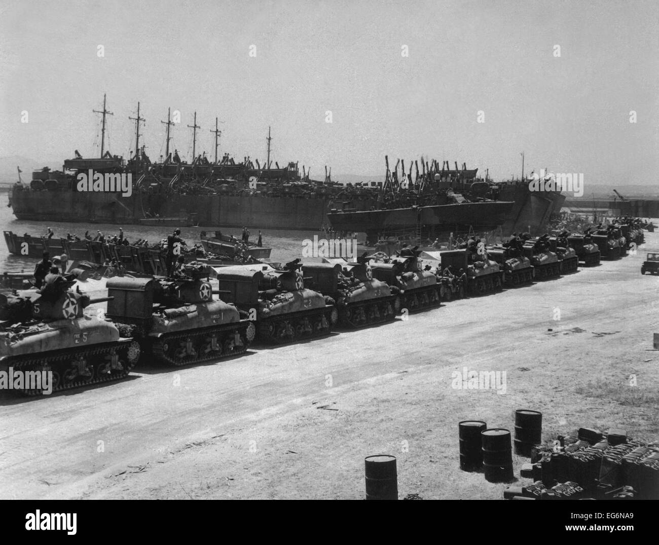 Two days before the Allied invasion of Sicily, tanks board landing craft. Ships are at the French Naval Base, La Pecherie, Stock Photo