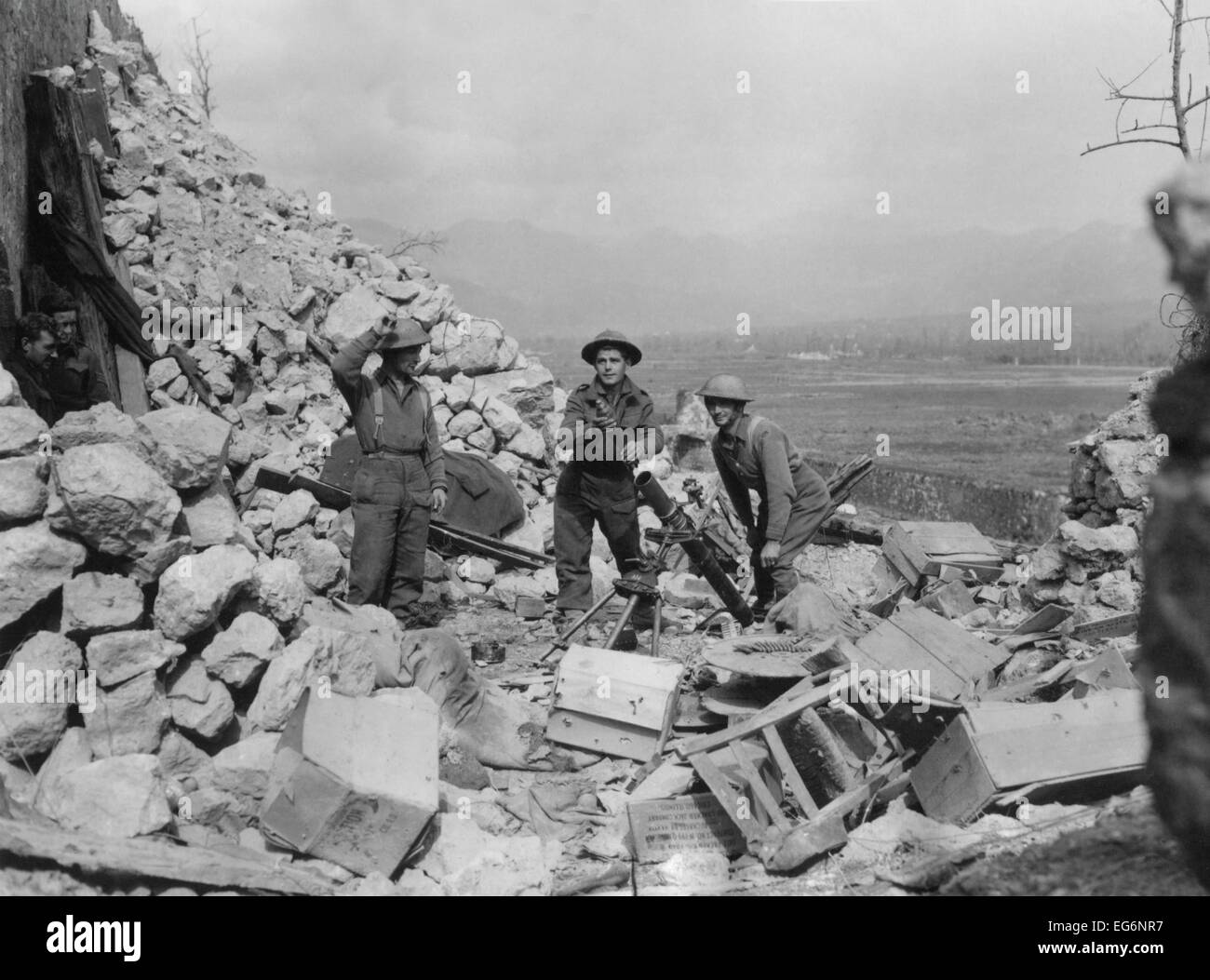 New Zealand mortar crew in Cassino ruins. They are attacking German troops who still occupy the south end of the town. Ca. Stock Photo