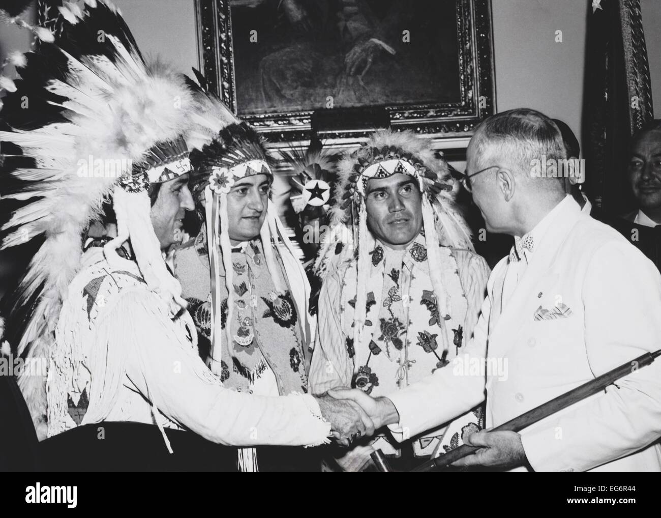 President Truman was presented a pipe said to have once been smoked by Sitting Bull. He had just signed the Indian Claims Stock Photo