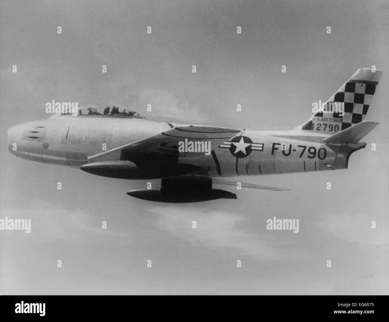 F-86 Sabre Jet was the first U.S. jet fighter to have swept wings. This one is headed toward 'MIG Alley' in north west North Stock Photo