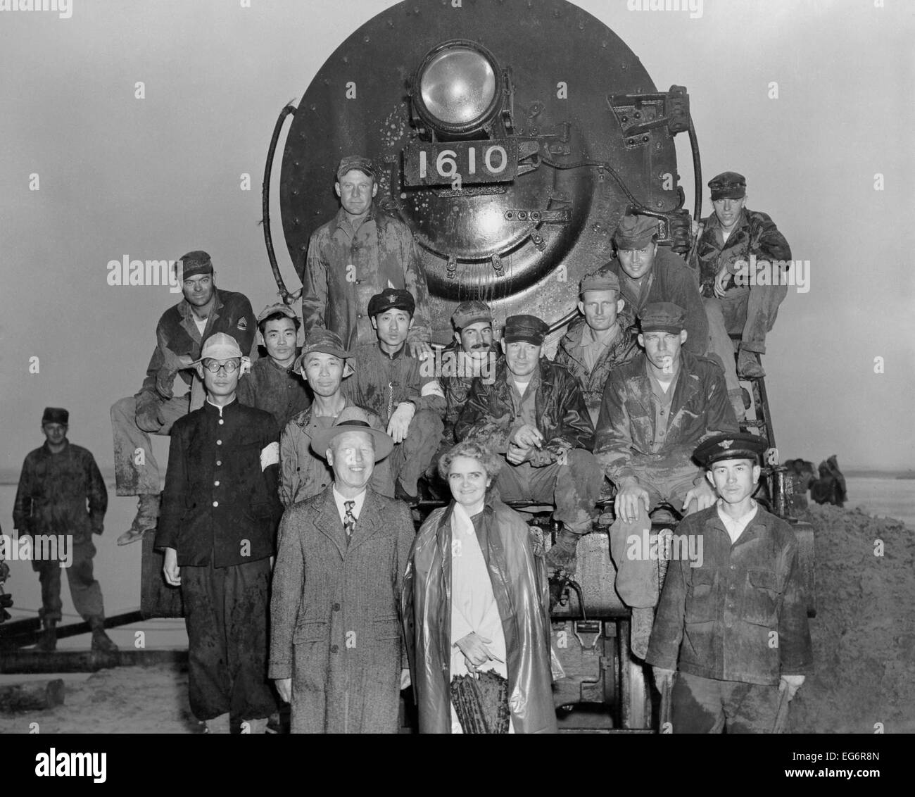 President Syngman Rhee, and Mrs. Rhee with US Army engineers and Korean train crew. They are celebrating the newly constructed Stock Photo