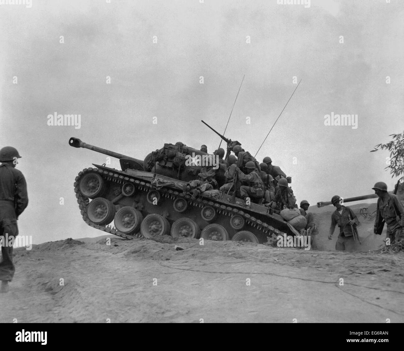 Soldiers on a M-26 tank await an North Korean attempt to cross the Naktong River. Sept. 3, 1950. Second Battle of the Naktong Stock Photo