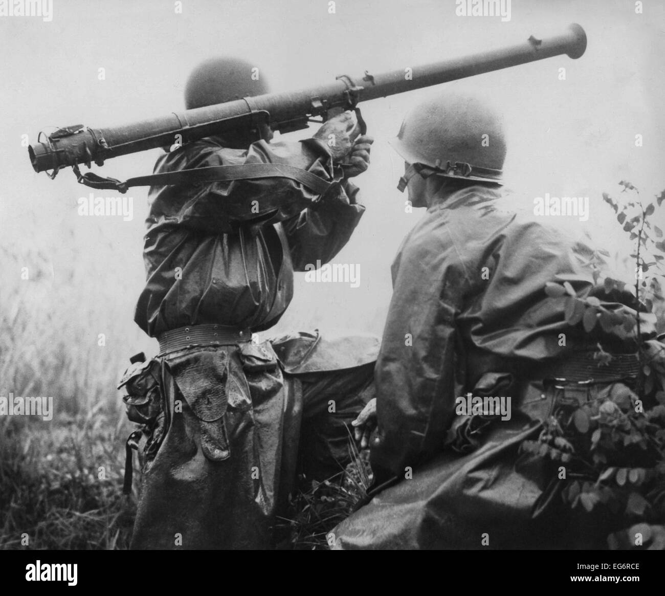 U.S. soldier aims a 2.36-inch bazooka at a North Korean tank during the Battle of Osan. On his right is Kenneth R. Shadrick, Stock Photo