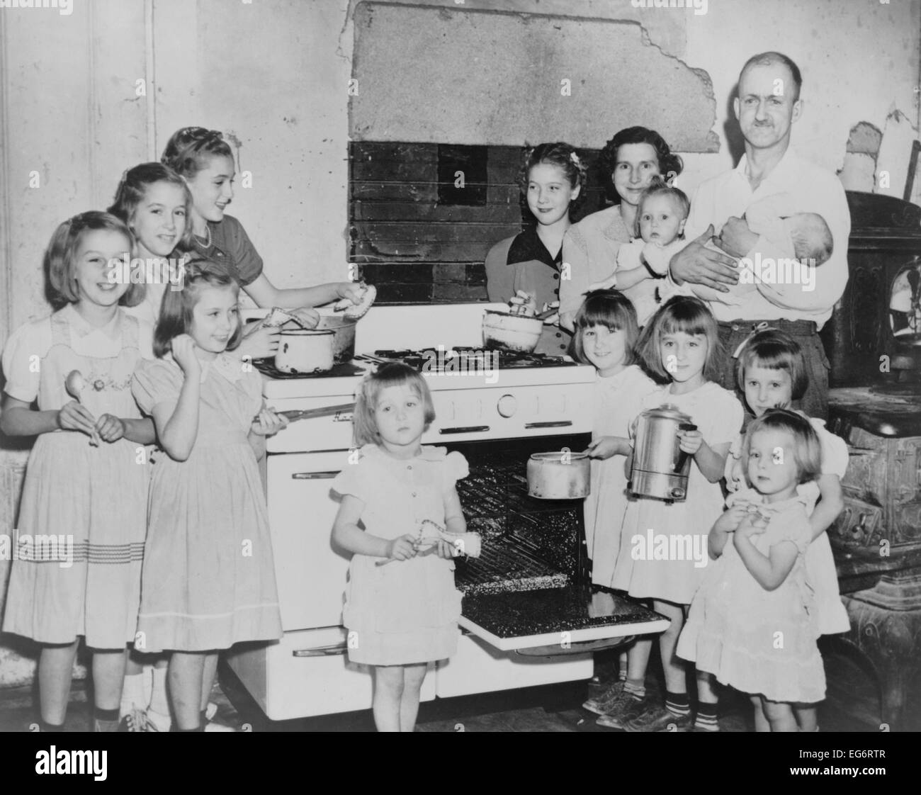 Mr. and Mrs. Lloyd Brooks of Pittsfield, Maine, and their 12 daughters. They live on his salary as a woolen mill worker, by Stock Photo