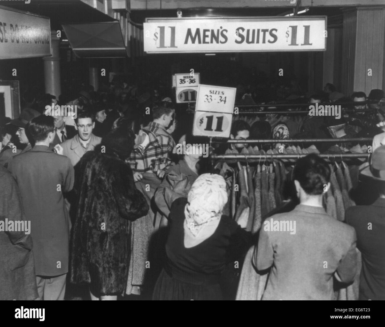 Crowded Boston department store where men's suits and top coats were on sale for $11.00. March 28, 1949. (BSLOC 2014 13 222) Stock Photo