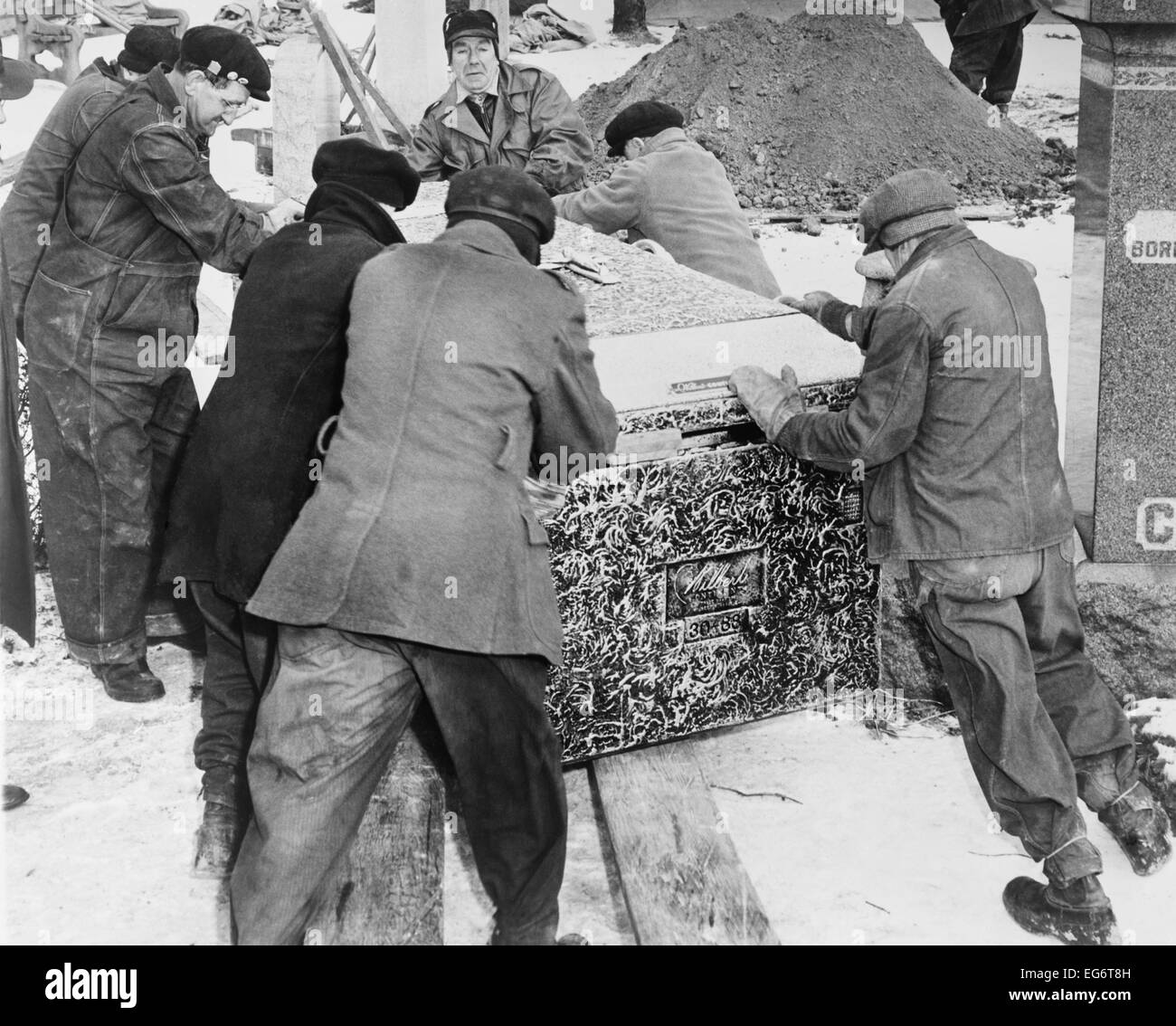 Burying Al Capone. Workmen at Mt. Olivet Cemetery in Chicago moving the vault with Al Capone's body. Feb. 6, 1947. Stock Photo