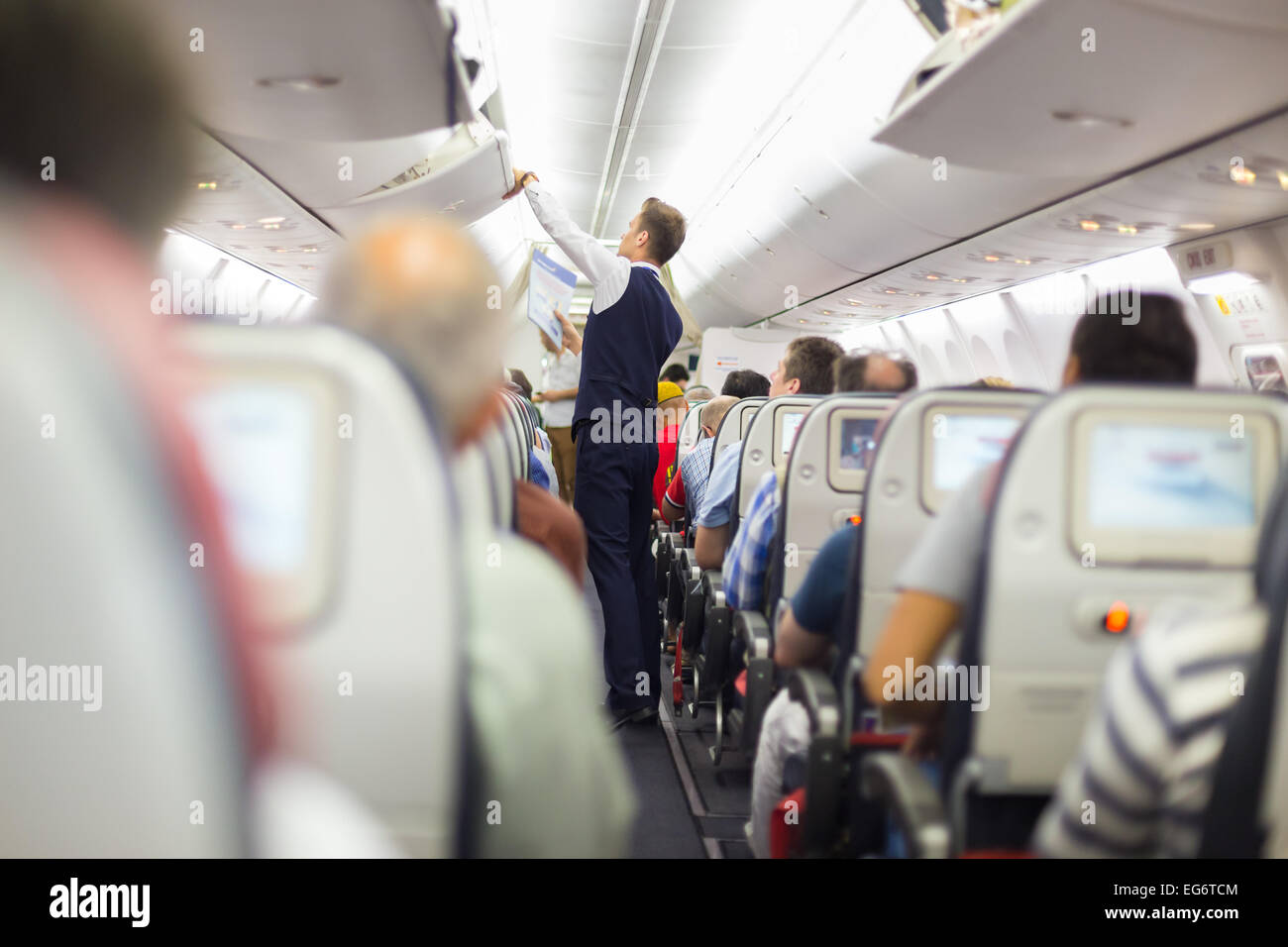 Steward on the airplane. Stock Photo
