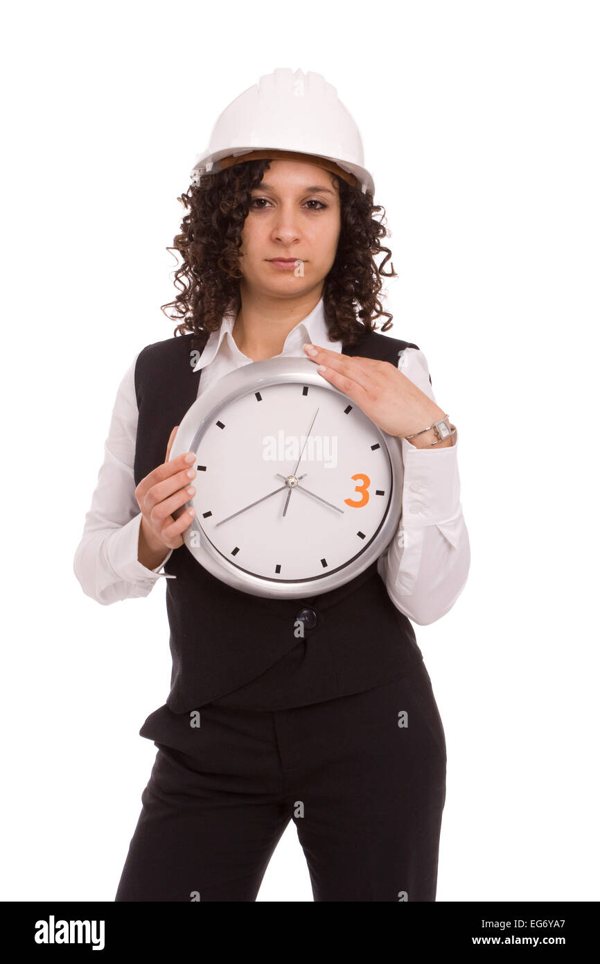 Young engineer holding a clock, isolated over white Stock Photo Alamy