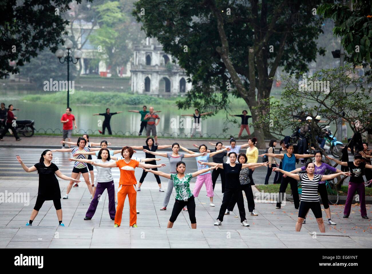 Early-morning exercise at Hoan Kiem Lake in Hanoi, Vietnam. Stock Photo