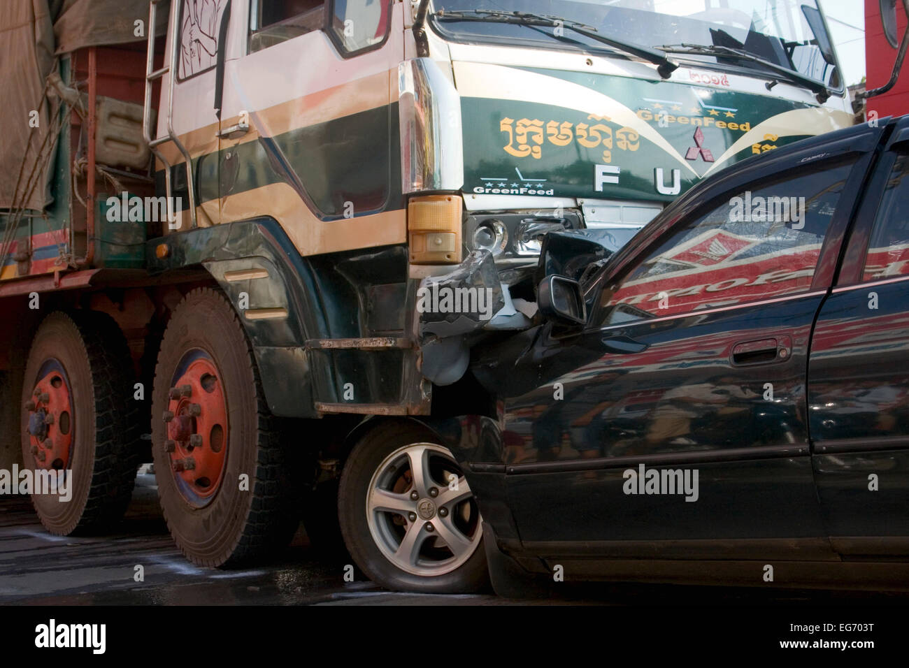 The aftermath of a head on collision between a car and a truck on ...