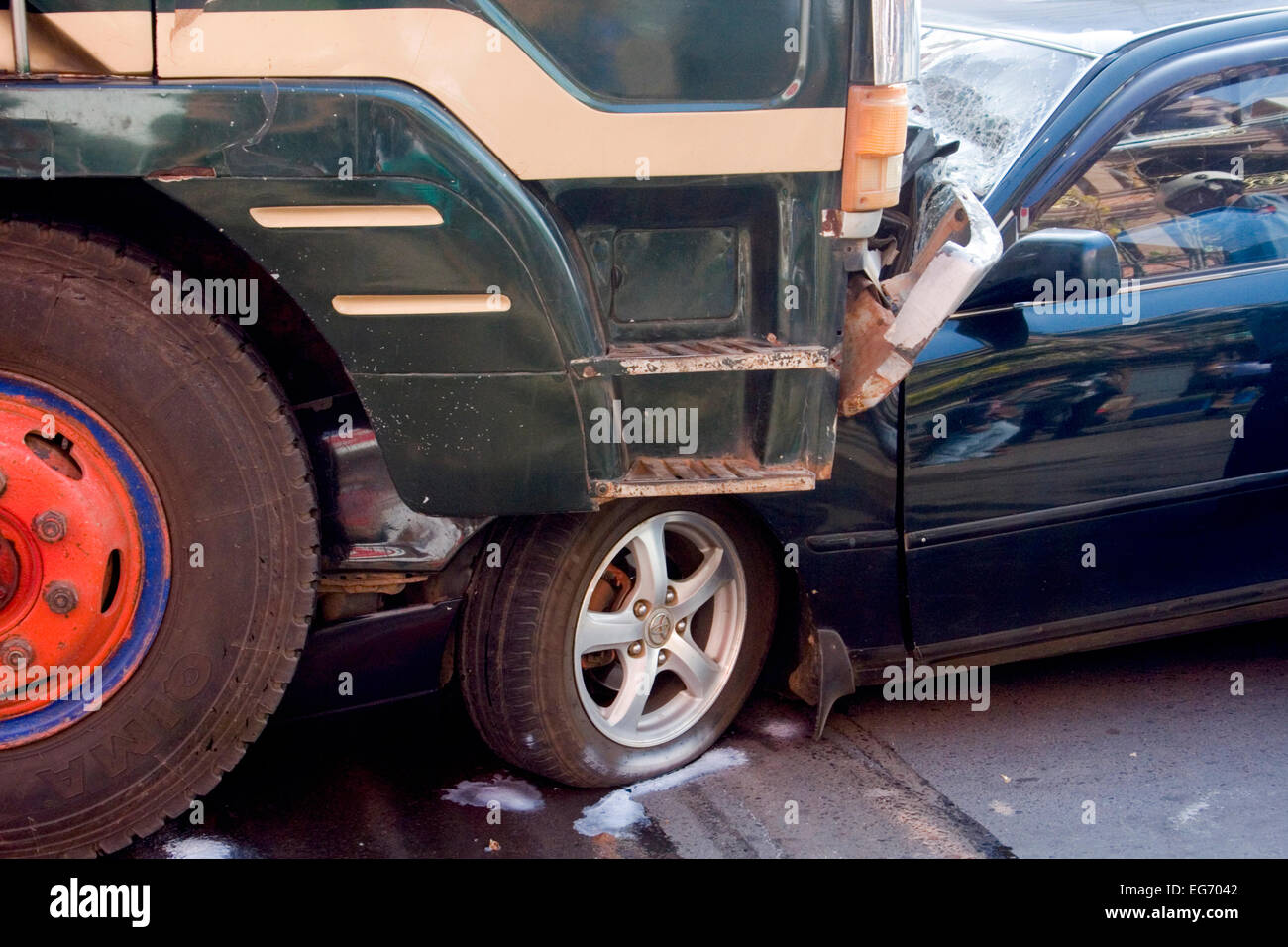 The aftermath of a head on collision between a car and a truck on ...