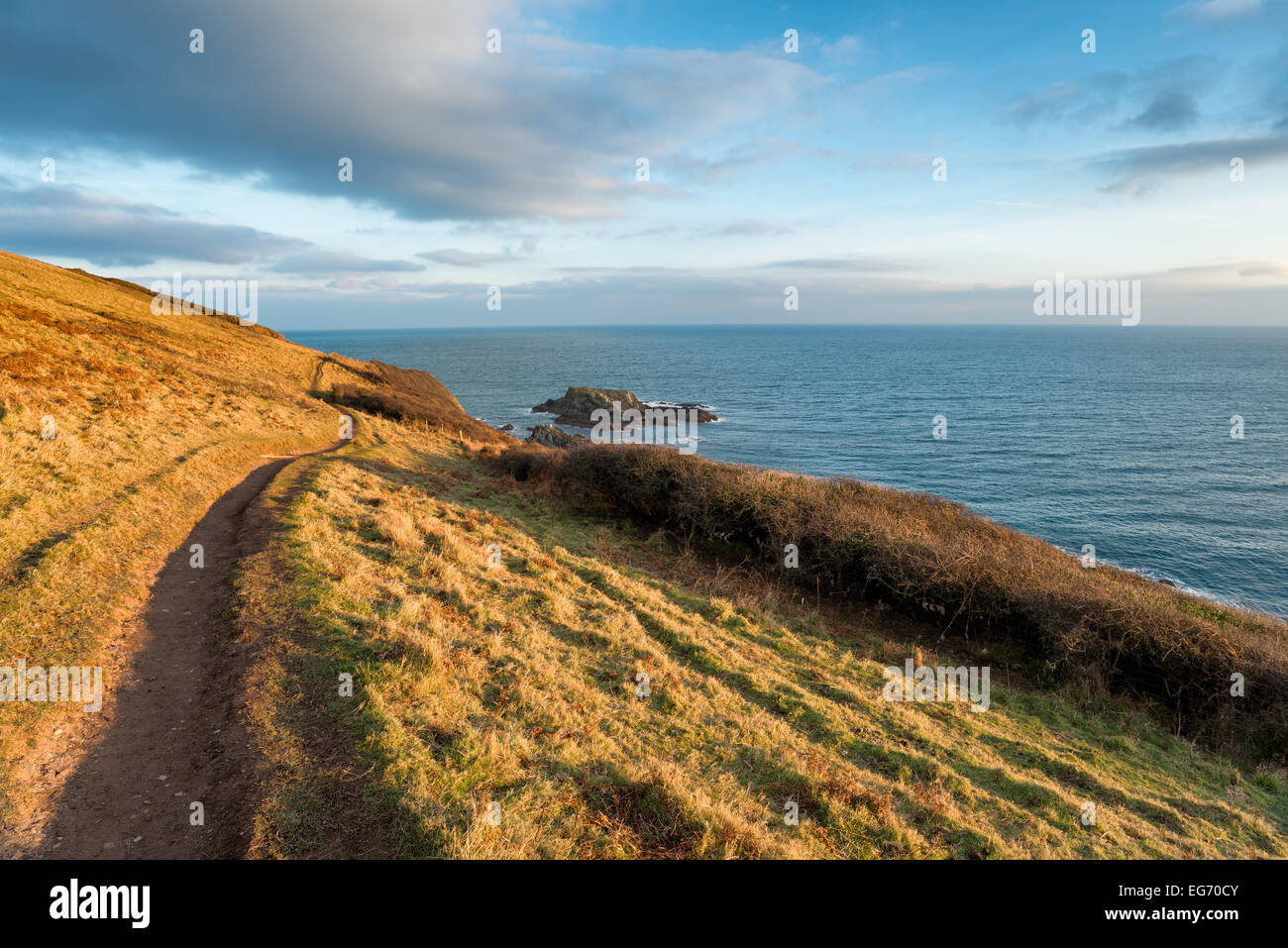 The South Swest Coast Path as it leaves Talland Bay in Cornwall and heading towards Looe Stock Photo