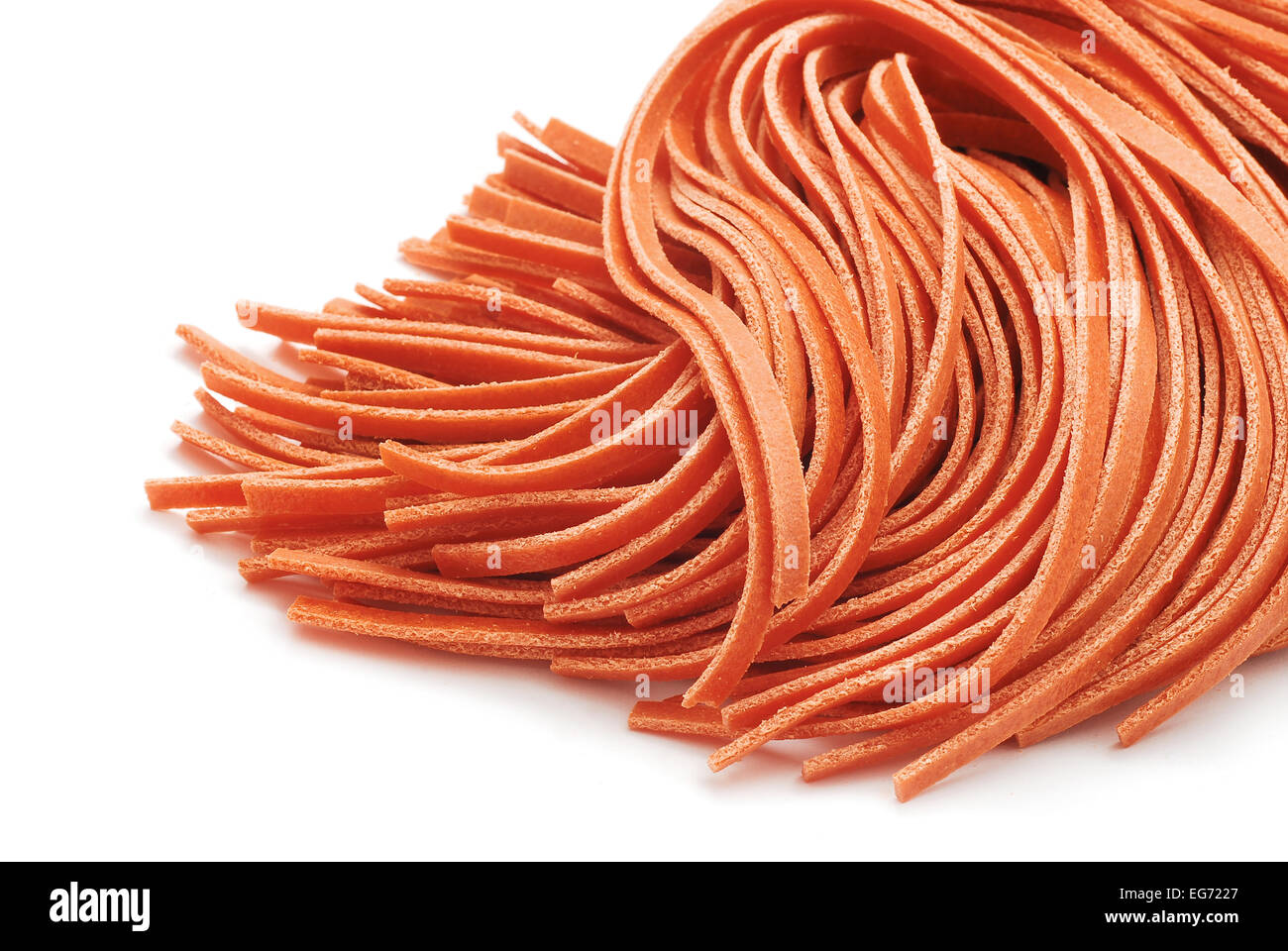 fettuccine red pasta on white Stock Photo