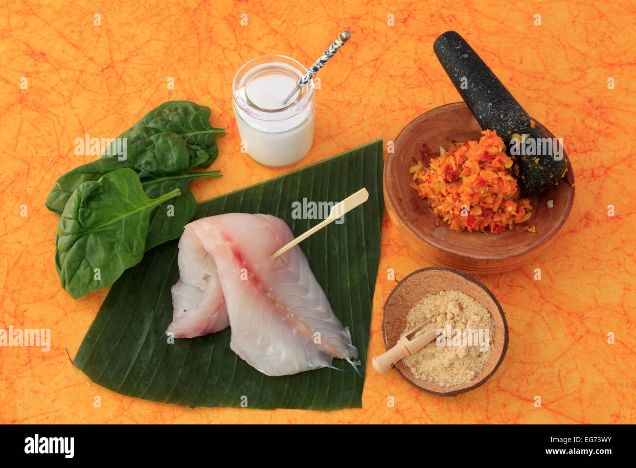 Amok, Cambodian dish, ingredients, fish, banana leaf, spinach, coconut milk, palm sugar, spice mix, mortar, Stock Photo