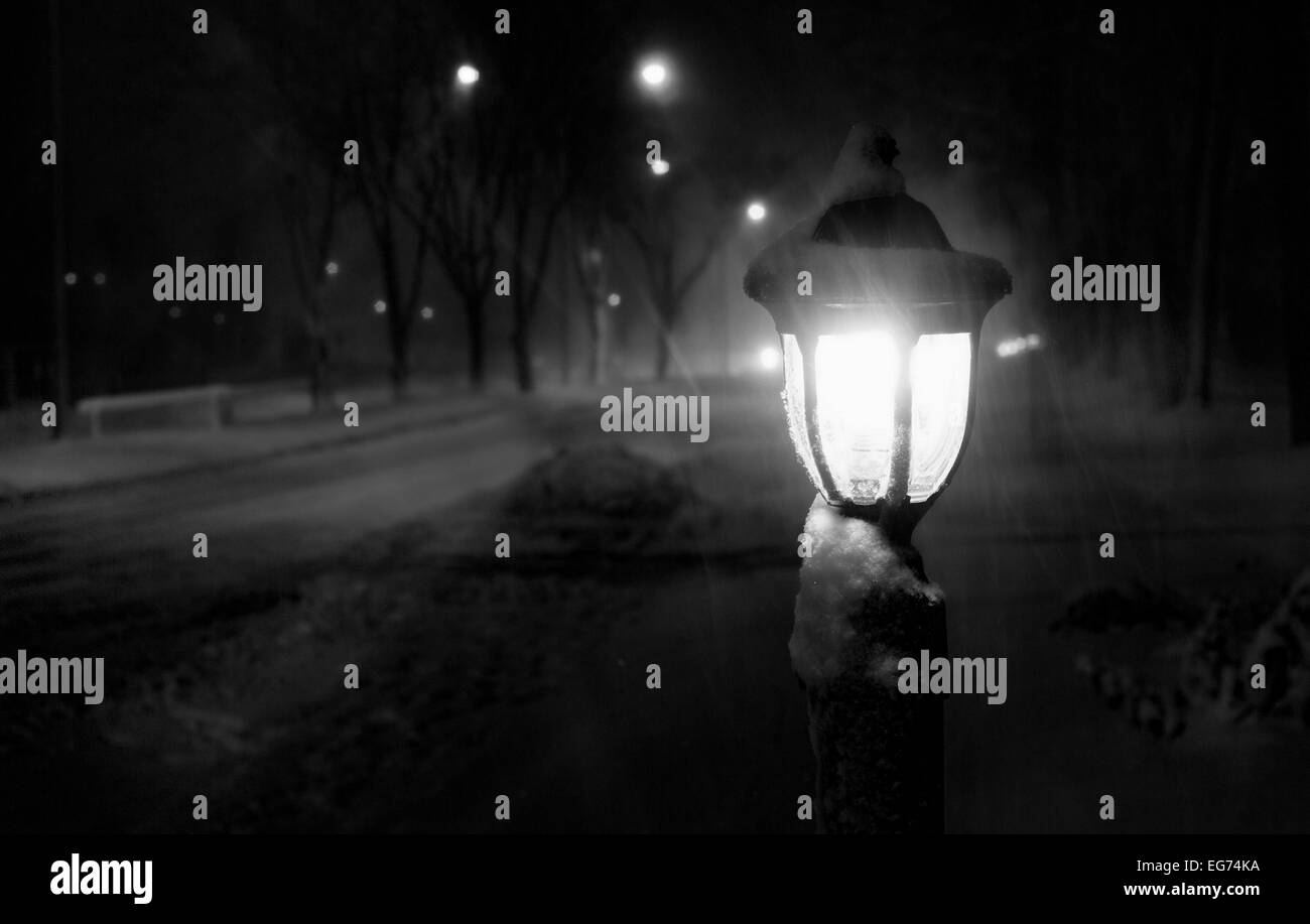 snowy night blizzard streetlight lantern Stock Photo