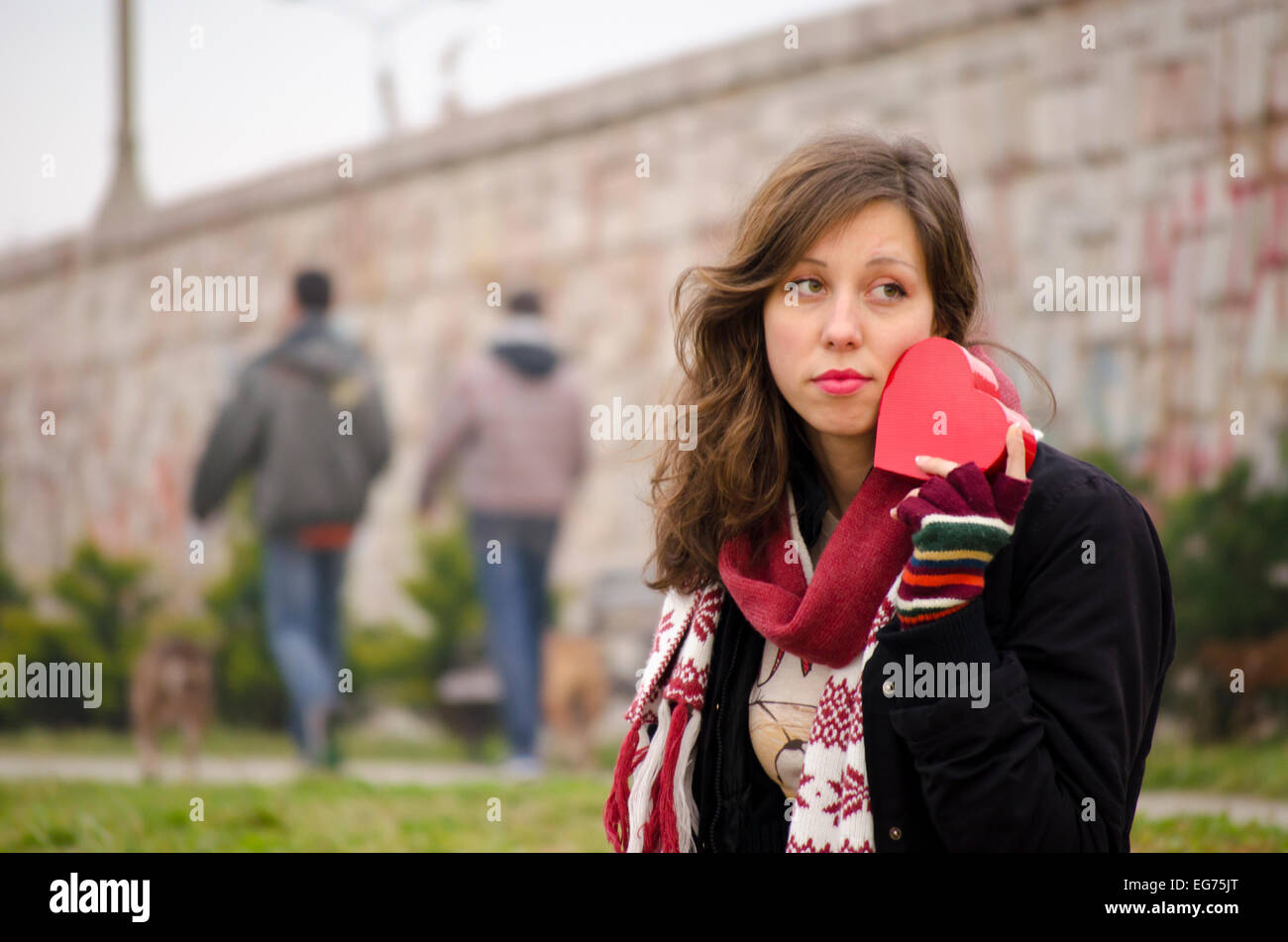Sad girl alone for Valentine outdoors, Stock Photo