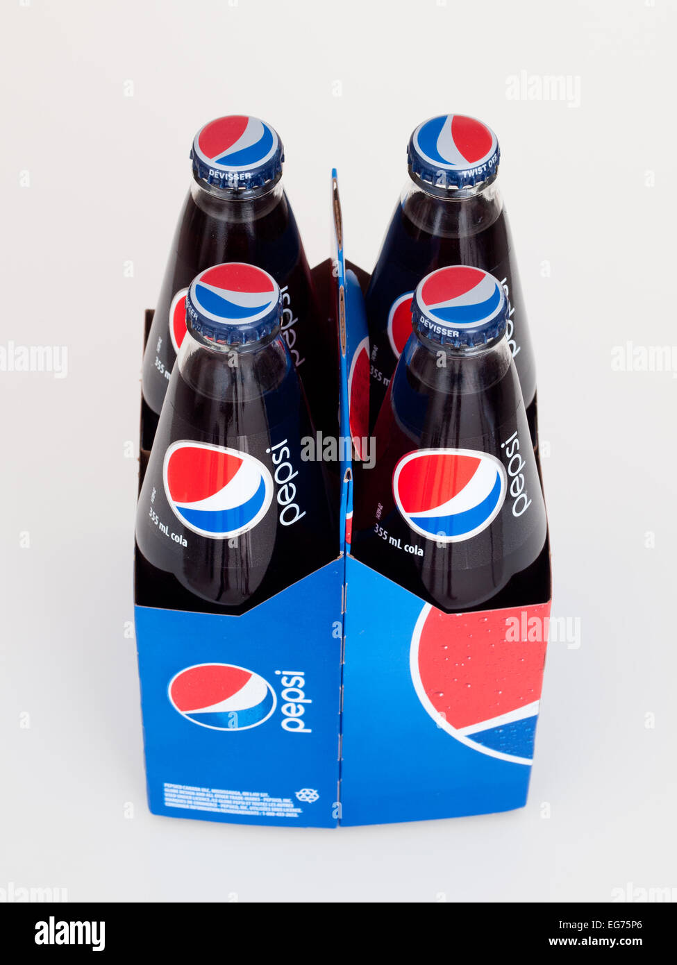 A 4pack of 355 mL glass bottles of Pepsi (PepsiCola). Canadian