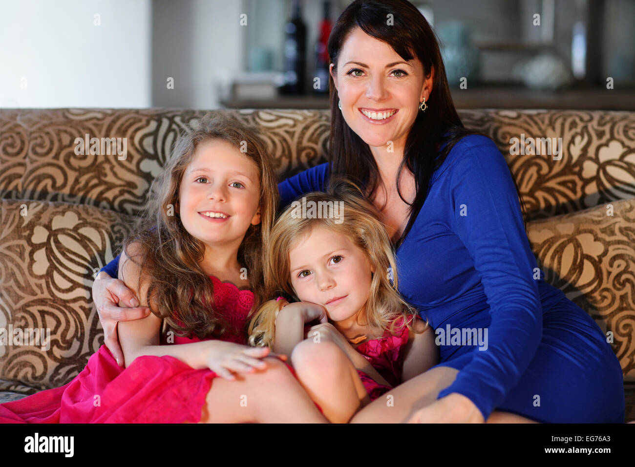 Single mom and her two pretty daughters Stock Photo
