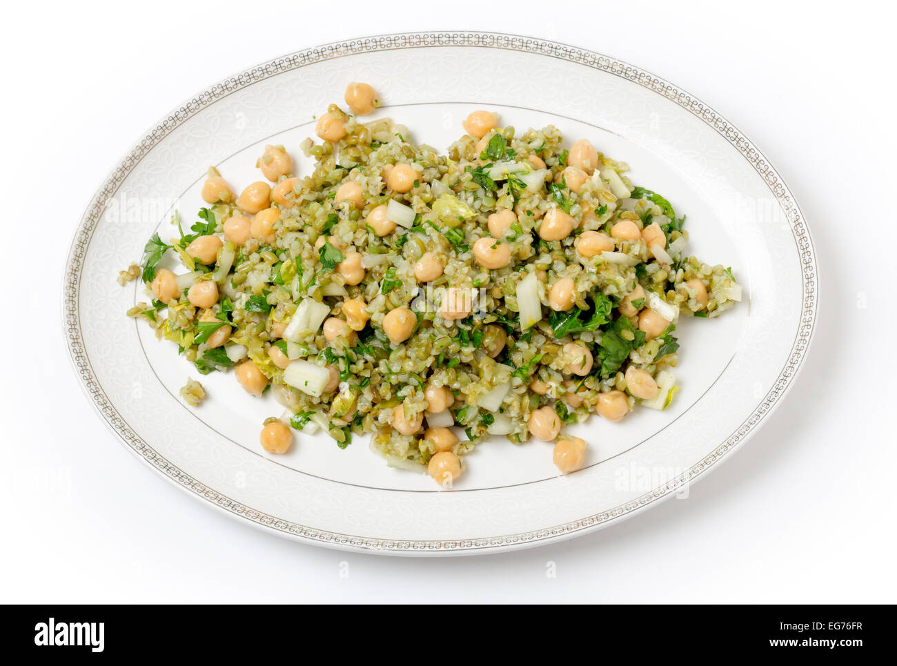 Freekeh salad with chickpeas, onion, parsley, celery, and a lemon juice and olive oil dressing Stock Photo