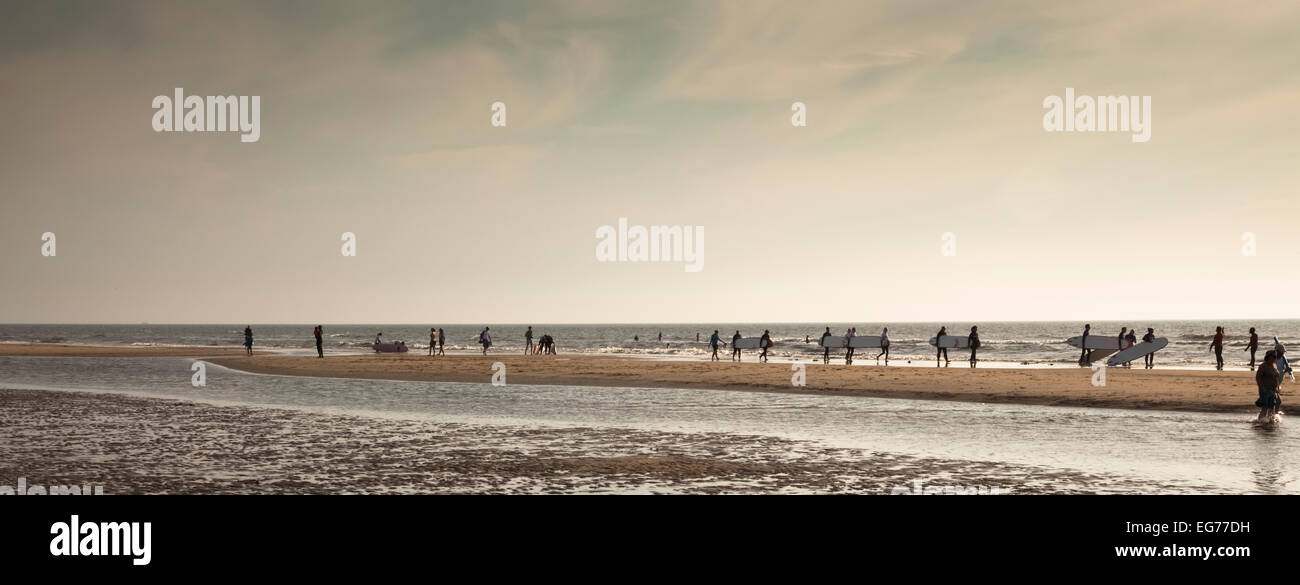 Netherlands, Bloemendaal, surfers on beach Stock Photo