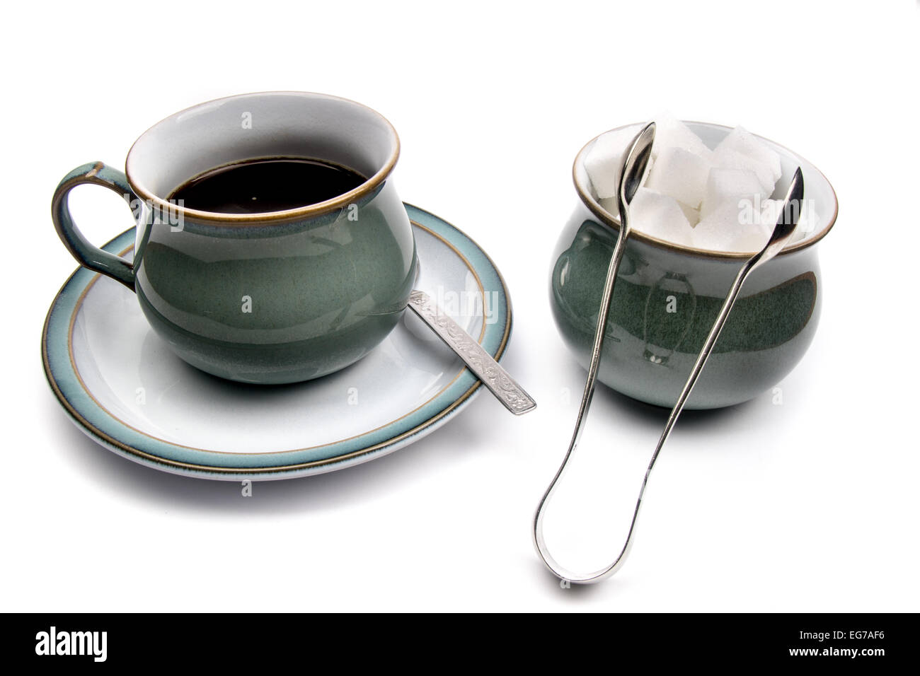 A Cup and Saucer of Black Coffee Next to A Sugar Bowl With Tongs Stock Photo