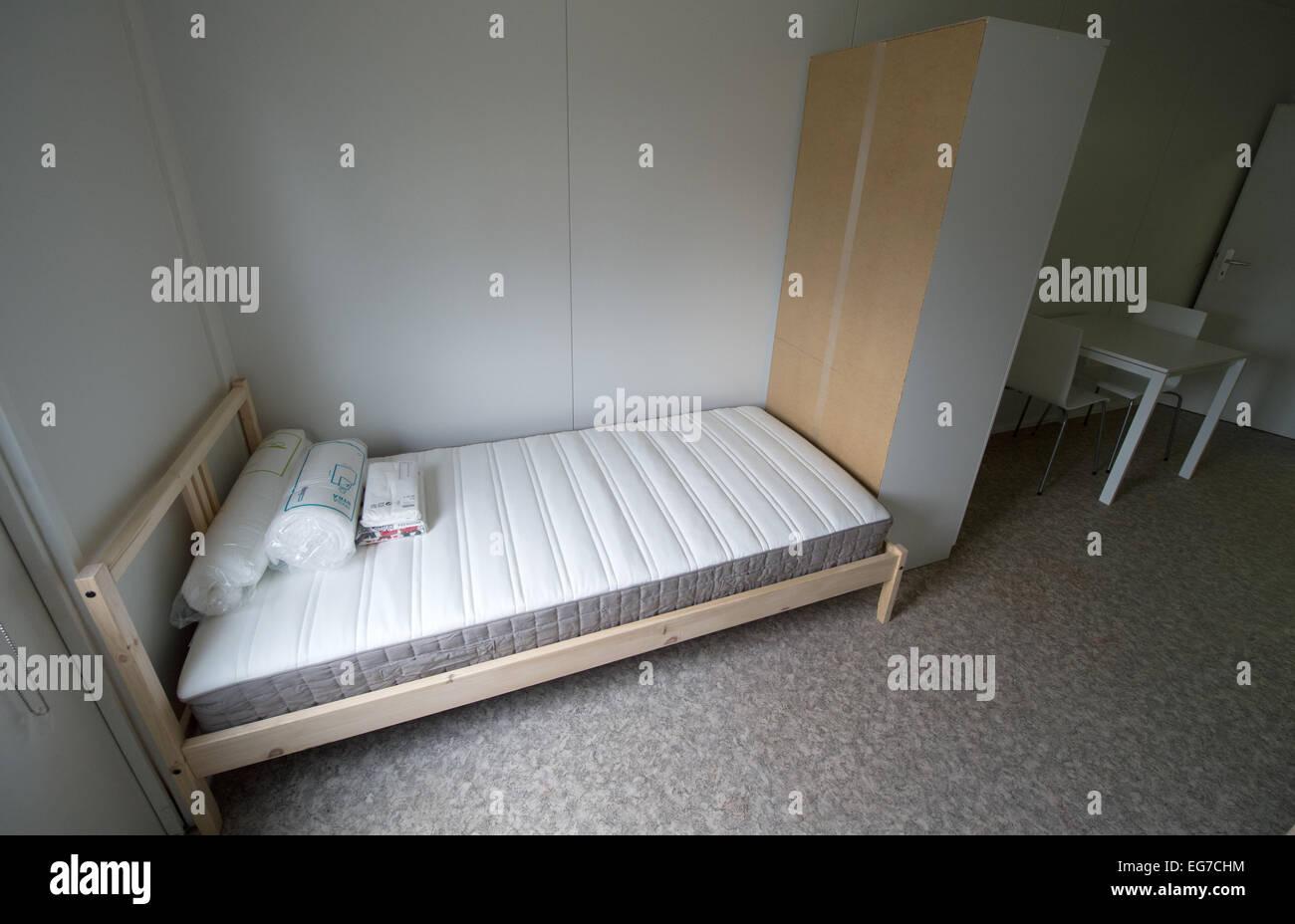 The rooms are furnished at the newly put in operation refugee accommodations in Frankfurt-Preungesheim, Germany, 18 February 2015. Here, refugees for the time being live in accommodation containers. PHOTO: BORIS ROESSLER/dpa Stock Photo